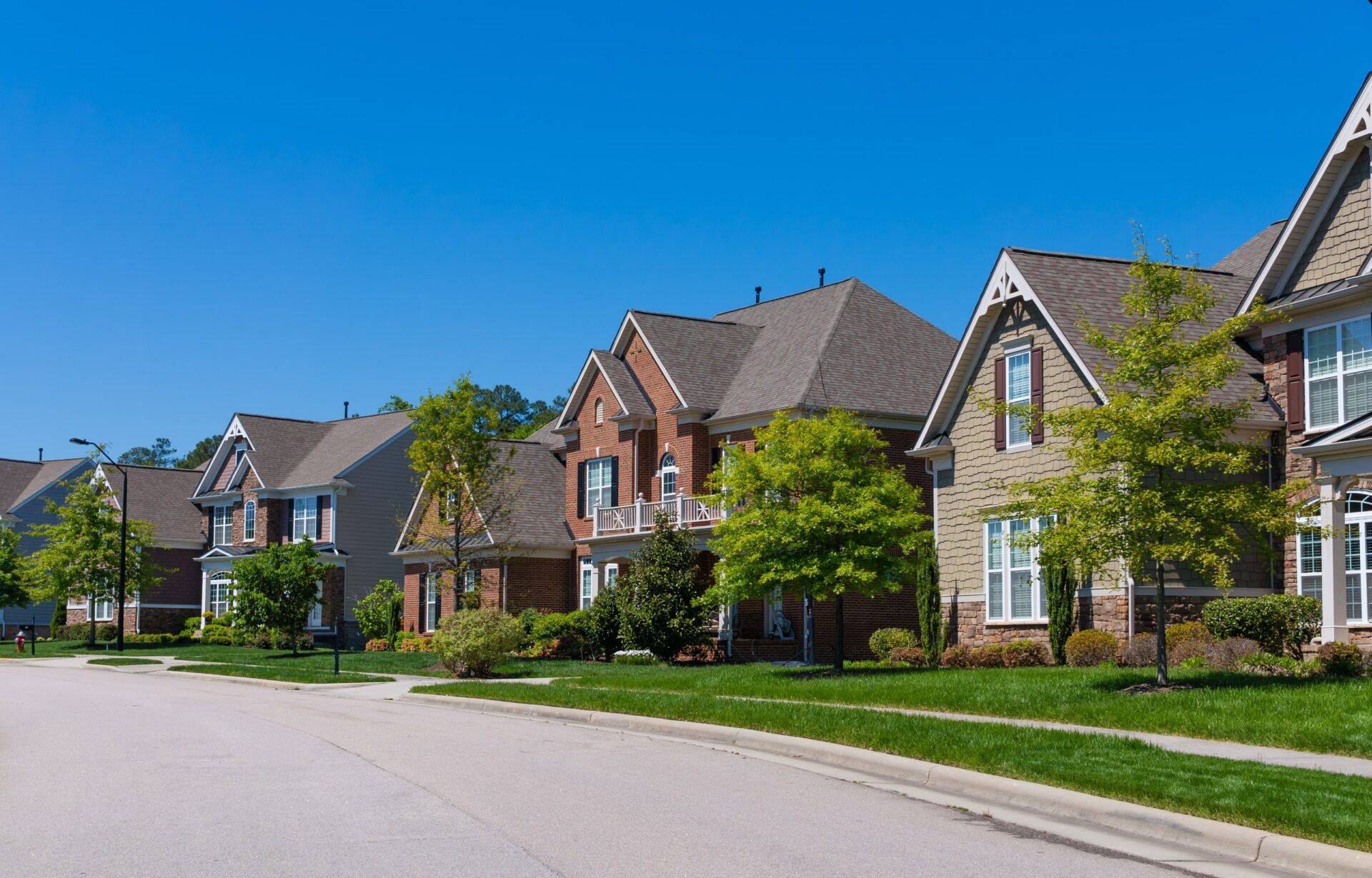 A residential street lined with large homes in Bozeman, Montana